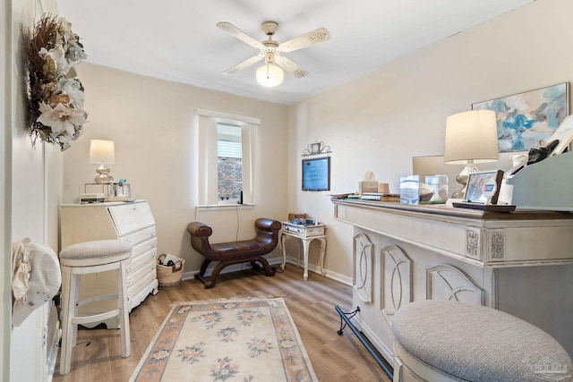 sitting room featuring light wood-type flooring and ceiling fan