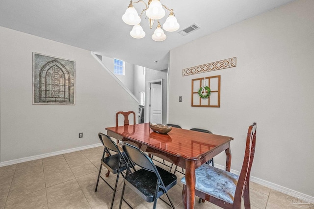 dining room featuring an inviting chandelier, light tile patterned floors, baseboards, and visible vents
