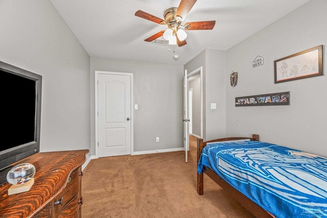 bedroom featuring baseboards, ceiling fan, visible vents, and light carpet