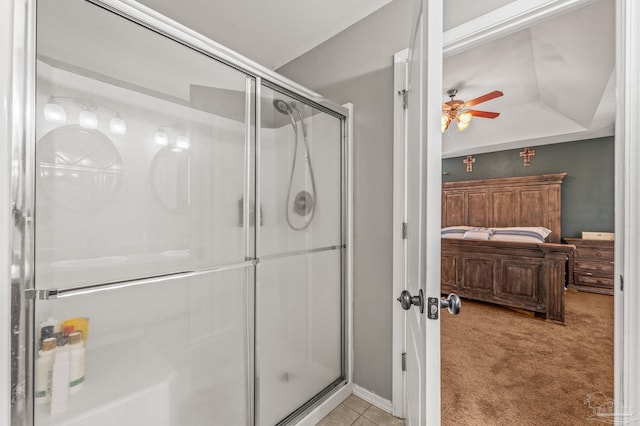 ensuite bathroom with ensuite bathroom, a stall shower, and ceiling fan