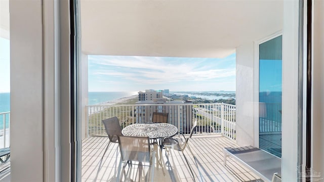 balcony featuring a water view