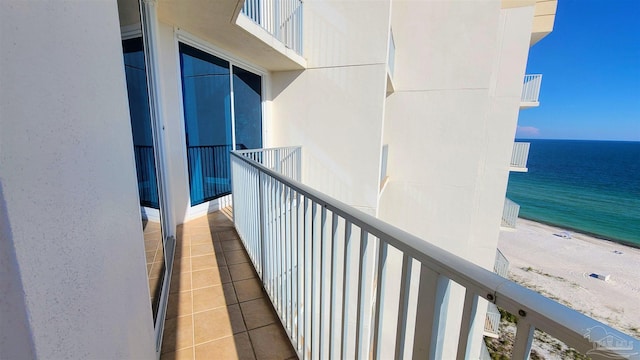 balcony with a view of the beach and a water view