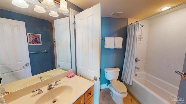 full bathroom featuring toilet, vanity, shower / bath combo with shower curtain, and tile patterned floors