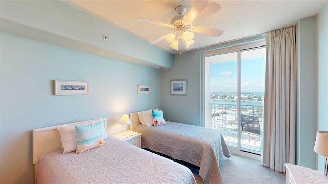 bedroom with multiple windows, access to exterior, carpet floors, and ceiling fan