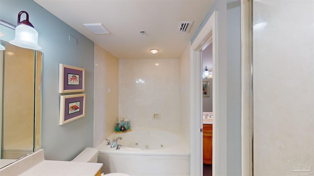 bathroom featuring vanity and a tub