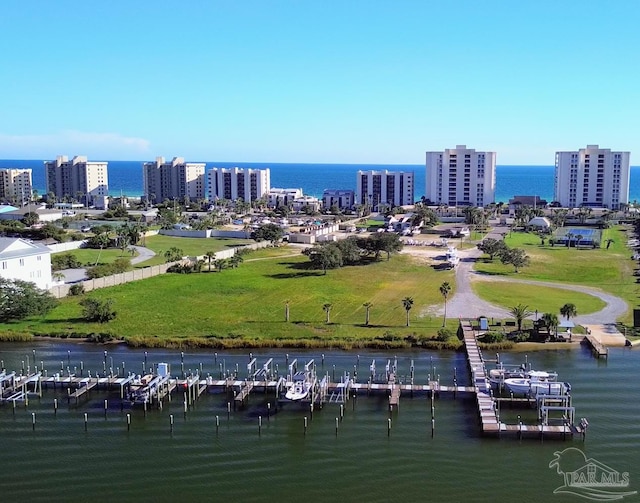 birds eye view of property with a water view