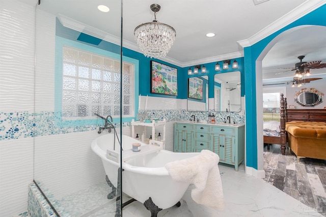 bathroom featuring a bathtub, ceiling fan with notable chandelier, vanity, tile walls, and tile patterned floors