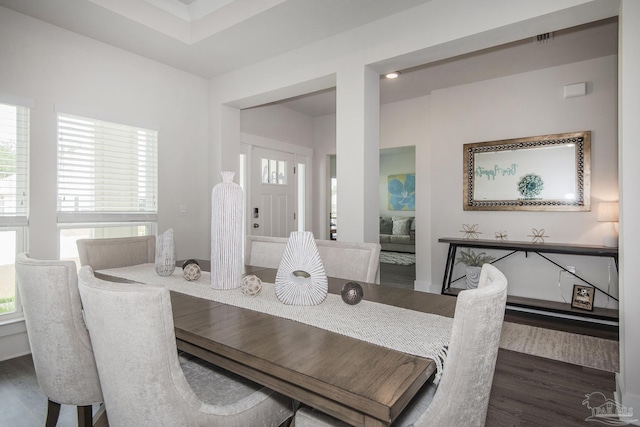 dining space featuring dark wood-style flooring