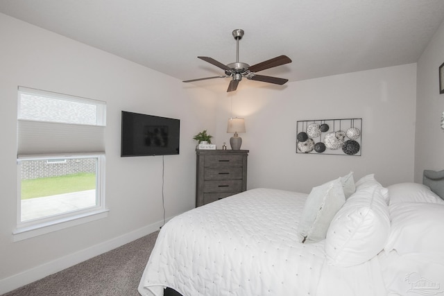 bedroom featuring carpet, baseboards, and a ceiling fan