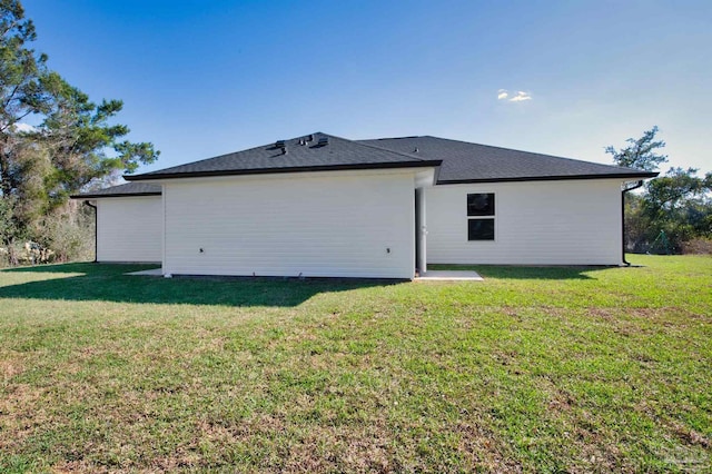 back of house with a yard