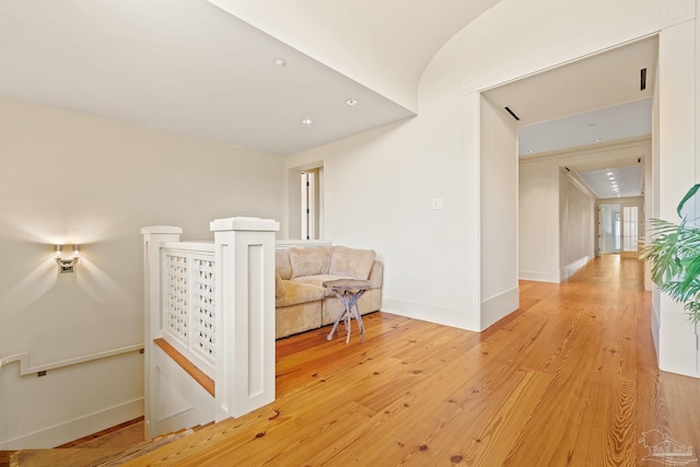 hall with light hardwood / wood-style flooring