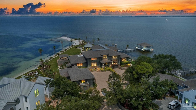 aerial view at dusk with a water view