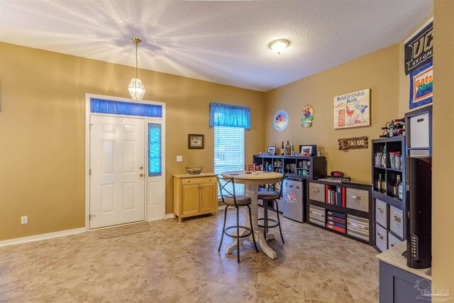 dining room with a textured ceiling