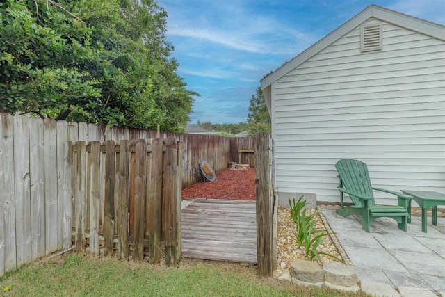 wooden deck featuring a patio area