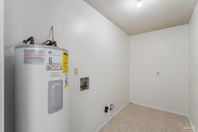 laundry room with electric water heater, washer hookup, and light tile patterned floors