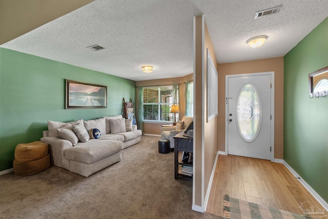 917 Broken Arrow Ln, Pensacola, FL 32533 - foyer entrance featuring baseboards, a textured ceiling, and wood finished floors