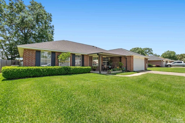 917 Broken Arrow Ln, Pensacola, FL 32533 - ranch-style home with concrete driveway, a garage, brick siding, and roof with shingles