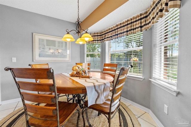 917 Broken Arrow Ln, Pensacola, FL 32533 - dining area with light tile patterned floors, healthy amount of natural light, baseboards, and a chandelier