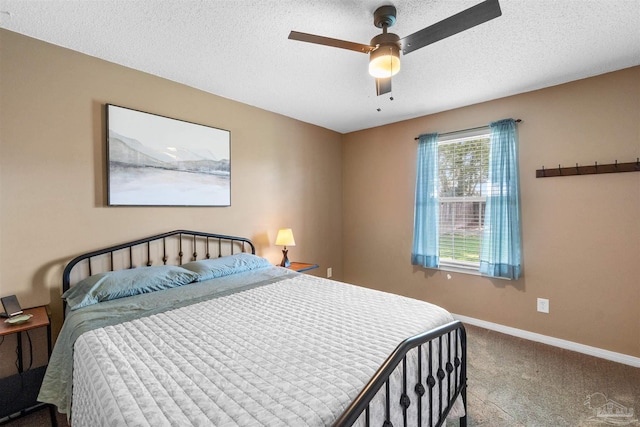 917 Broken Arrow Ln, Pensacola, FL 32533 - bedroom with carpet flooring, baseboards, a textured ceiling, and a ceiling fan