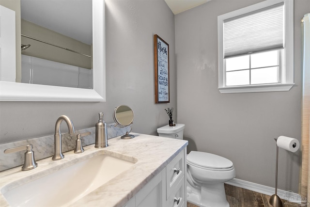 917 Broken Arrow Ln, Pensacola, FL 32533 - bathroom with wood finished floors, baseboards, vanity, and toilet