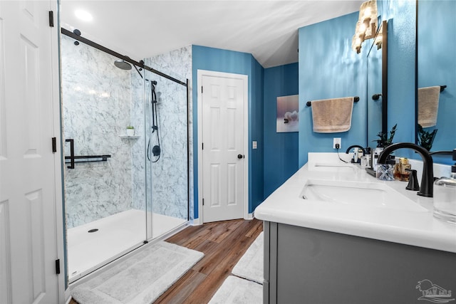 917 Broken Arrow Ln, Pensacola, FL 32533 - bathroom with a shower stall, wood finished floors, and double vanity