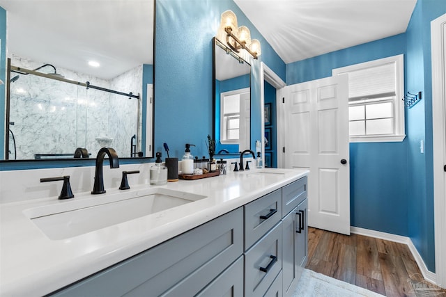 917 Broken Arrow Ln, Pensacola, FL 32533 - bathroom with a stall shower, wood finished floors, double vanity, and baseboards
