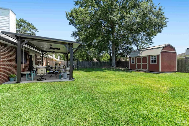 917 Broken Arrow Ln, Pensacola, FL 32533 - view of yard with a ceiling fan, a patio area, a storage shed, and an outdoor structure