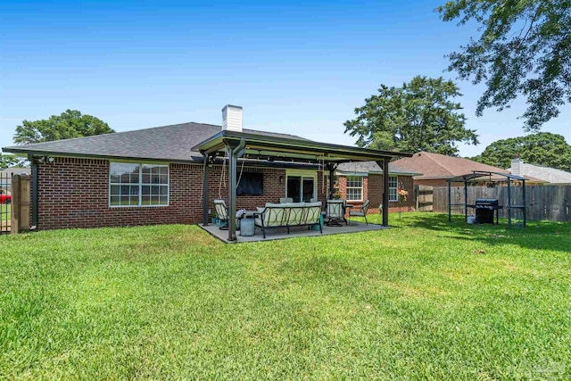 917 Broken Arrow Ln, Pensacola, FL 32533 - rear view of property with a gazebo, brick siding, an outdoor hangout area, and a chimney