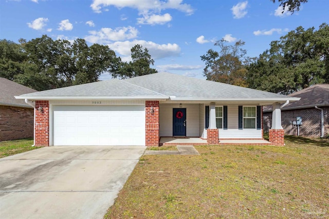 ranch-style home with covered porch, a garage, and a front lawn