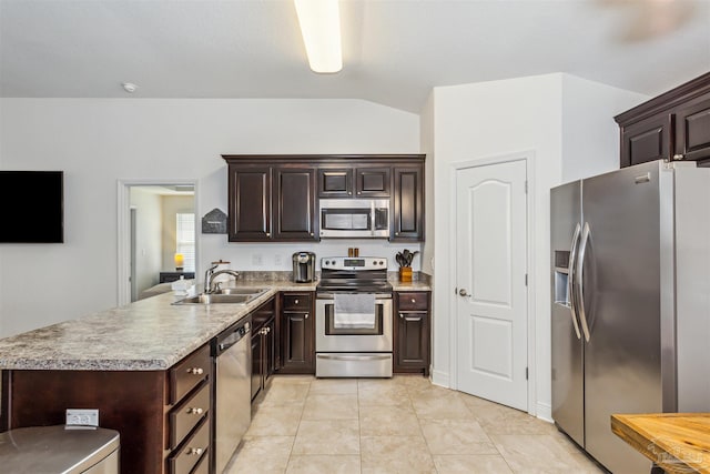 kitchen featuring dark brown cabinetry, sink, and appliances with stainless steel finishes