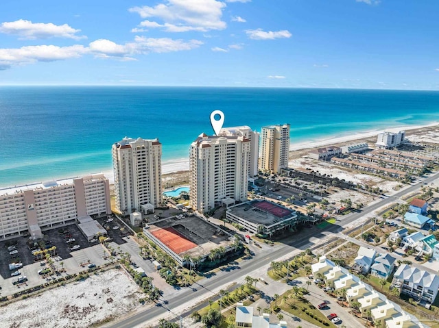 aerial view with a water view and a view of the beach