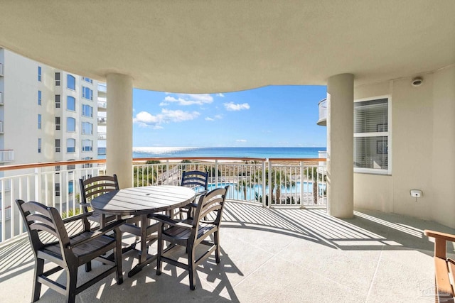 balcony featuring a water view