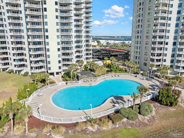 view of pool featuring a water view