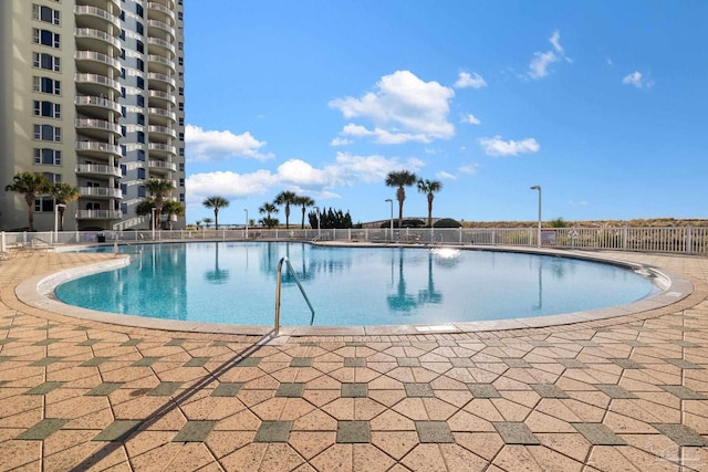 view of swimming pool with a patio