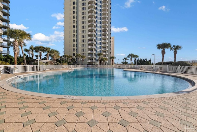 view of swimming pool with a patio area