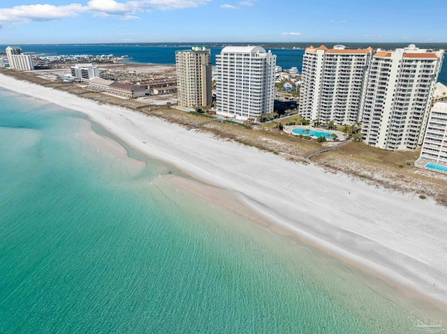 aerial view with a water view and a view of the beach