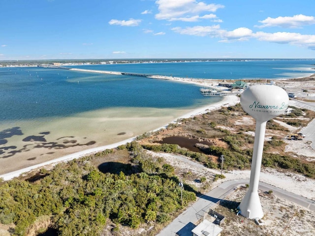 bird's eye view featuring a view of the beach and a water view