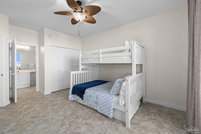 bedroom with ceiling fan and a closet