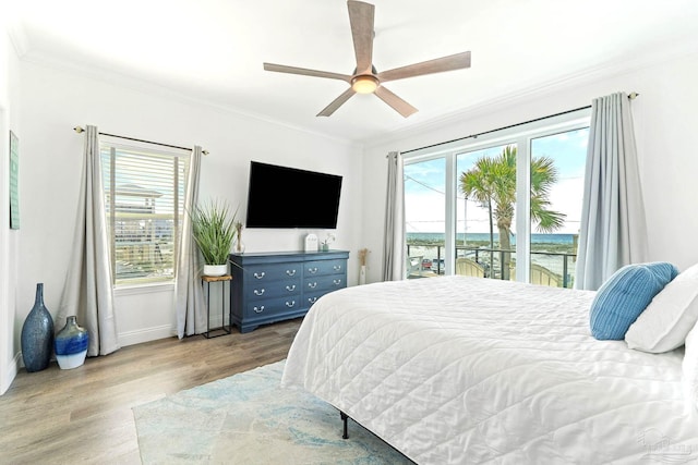 bedroom featuring access to exterior, crown molding, ceiling fan, and light wood-type flooring