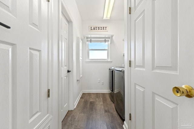 washroom featuring dark hardwood / wood-style flooring and independent washer and dryer