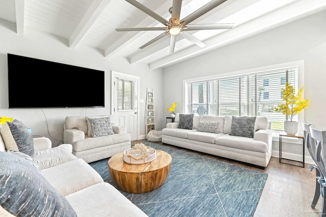 living room featuring beamed ceiling, ceiling fan, and wood-type flooring