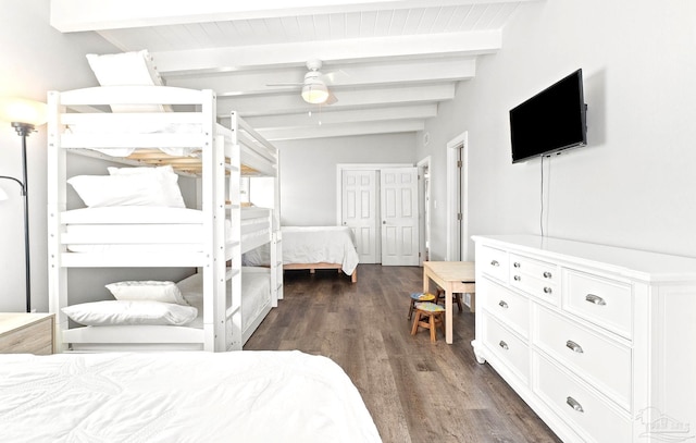 bedroom with dark hardwood / wood-style flooring, vaulted ceiling with beams, and ceiling fan