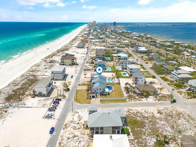 bird's eye view featuring a beach view and a water view