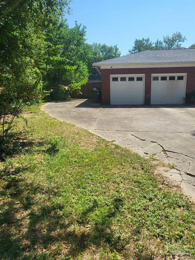 garage featuring a yard