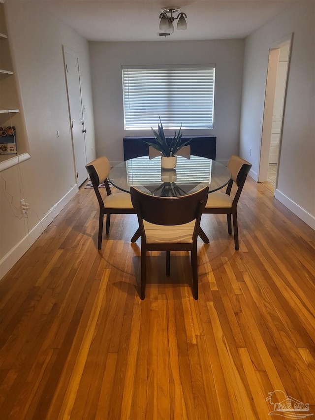 dining room featuring wood-type flooring