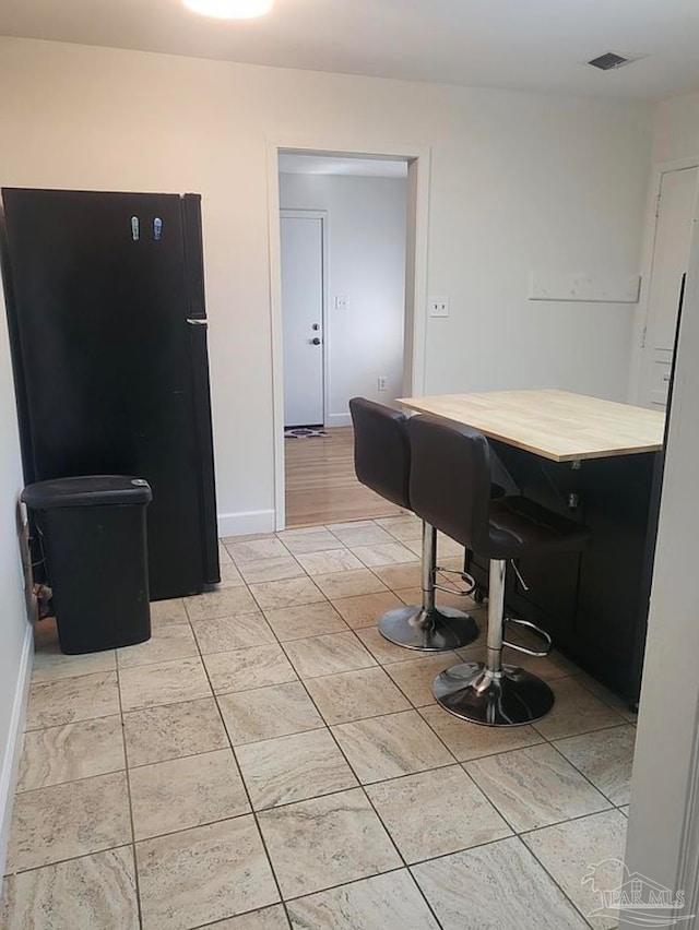 kitchen with black fridge