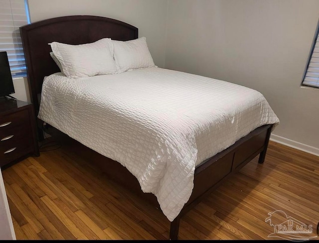 bedroom featuring hardwood / wood-style floors