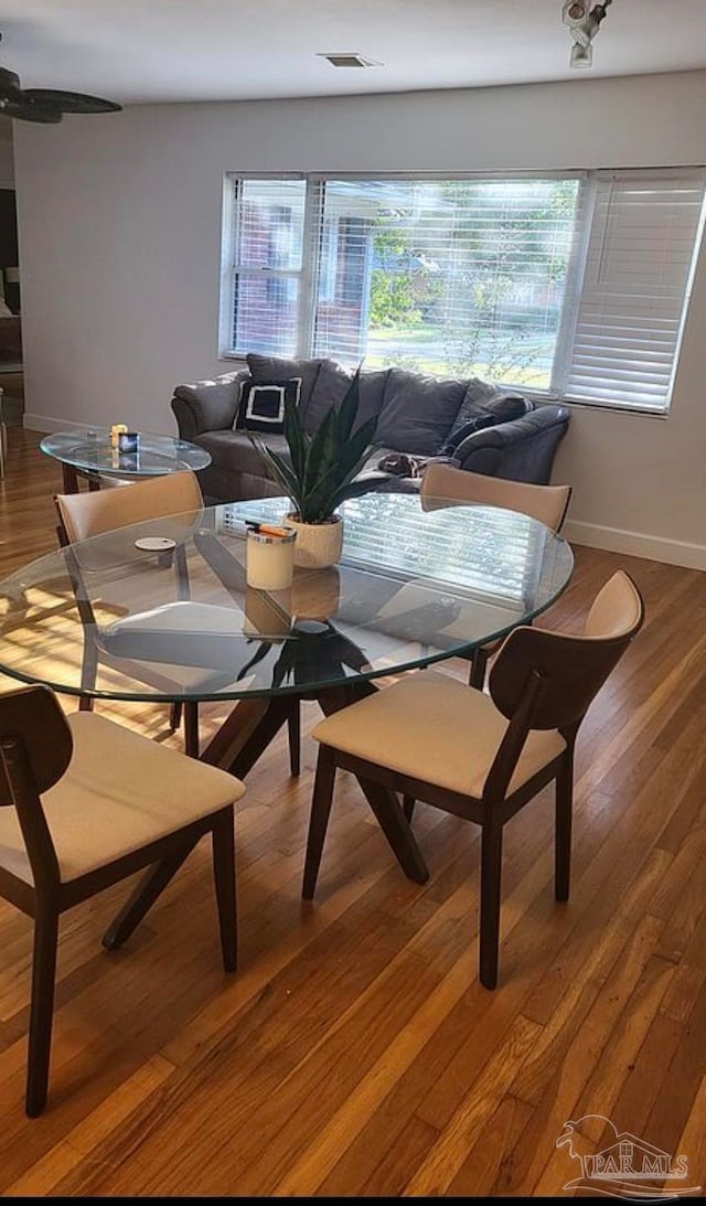 dining area featuring hardwood / wood-style floors