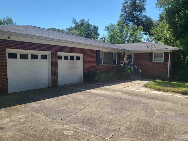 single story home featuring a garage