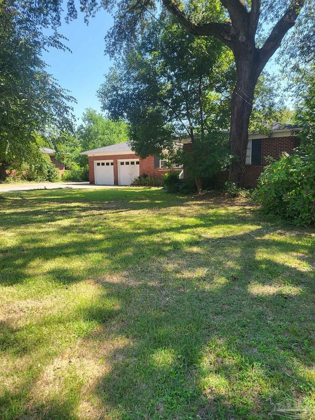 view of yard featuring a garage